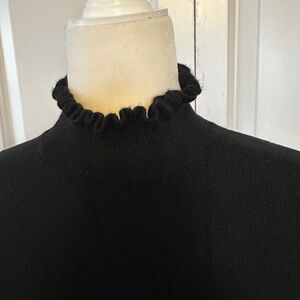 Ann Taylor black ruffled neck and cuffs sweater. Size M.